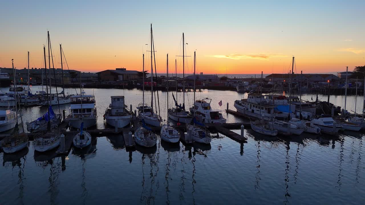 Boats Docked at Marina During Sunset in Moss Landing, California, United States