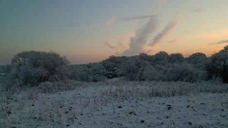 Beautiful-view-on-snow-and-frost-covered-countryside-in-United-Kingdom-during-winter-sunrise