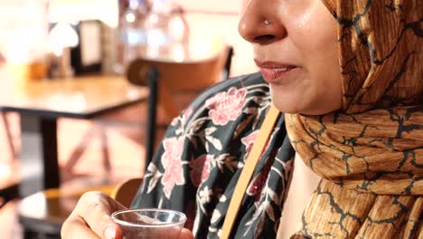 woman drinking tea in a cafe