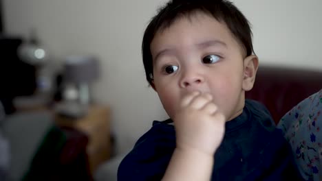 close up of baby eating in slow motion