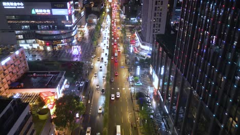 aerial drone shot of downtown traffic city of chengdu, china