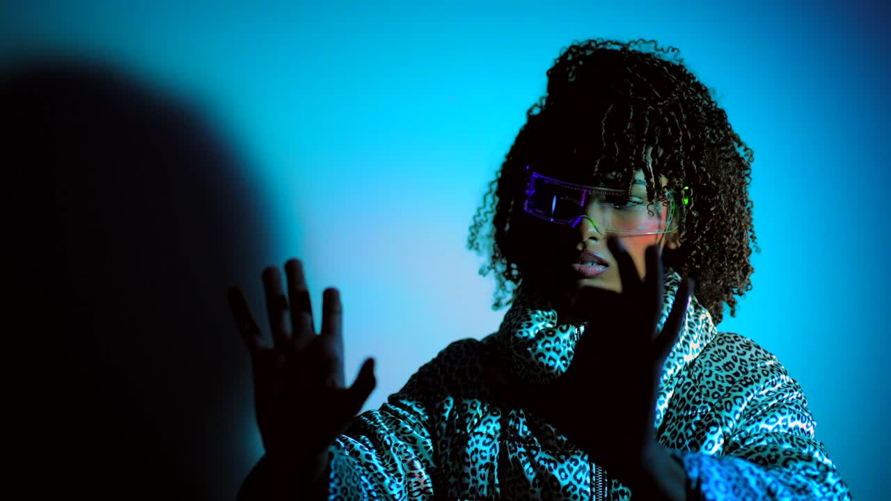 A woman in cyberpunk fashion with futuristic glasses and a leopard print jacket