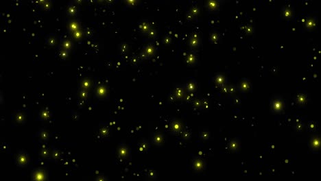 animation of glowing spots of yellow light on black background