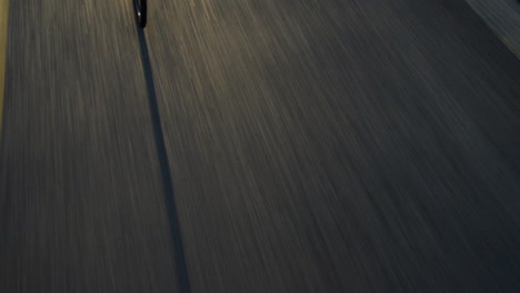 close-up-man-cycling-road-bicycle-outdoors-fitness-steadicam-shot