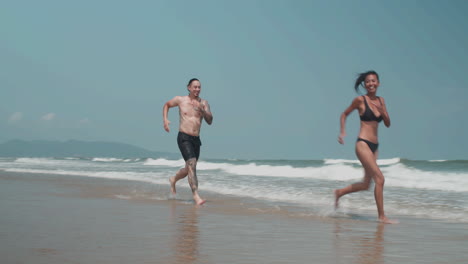 couple running at the shore