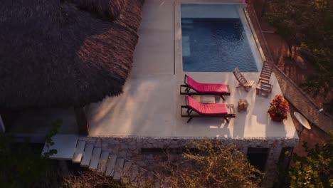 slow drone forward towards luxury rental villa with pool in oaxaca mexico pacific ocean 4k aerial