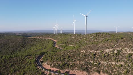 drone shot of a wind farm for eolic energy production in catalonia, spain