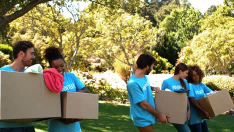 group of volunteers holding cartons