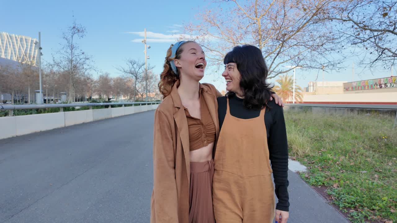 Two women walking down the street