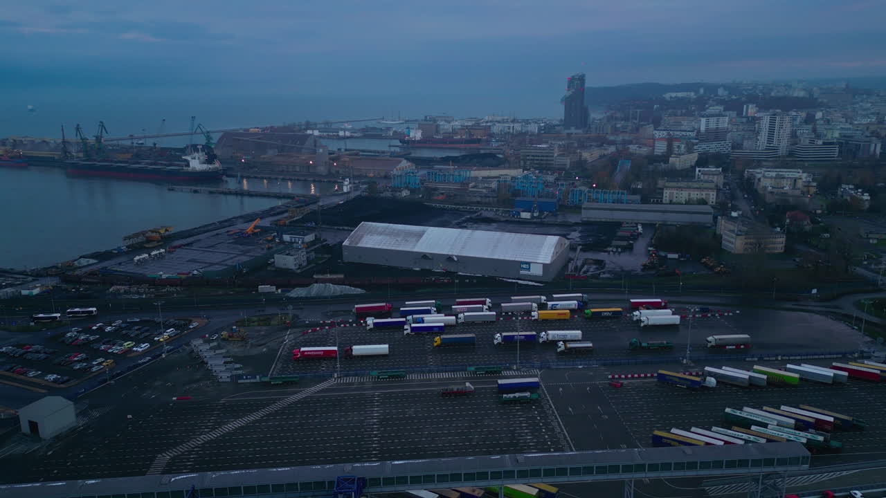 Aerial View of Gdynia Port with Trucks and Cityscape