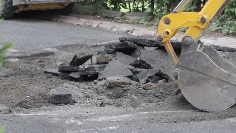 road repair with excavator