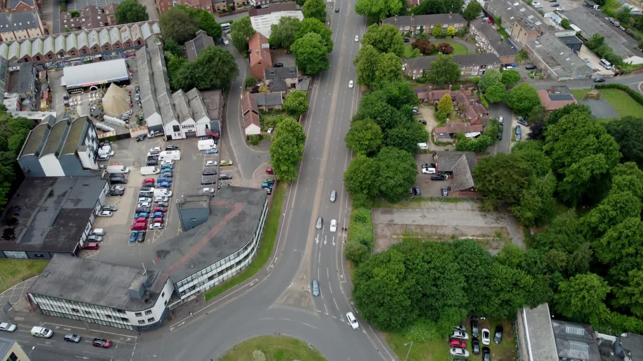 Aerial footage over Norwich Inner Ring Road, Norfolk. Footage is slightly angled down starting over a roundabout on St Crispins Road. Cars moving along this road and shows the surrounding buildings
