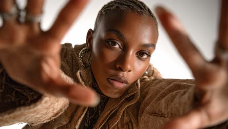 fashion model reaching towards camera in slow motion montage
