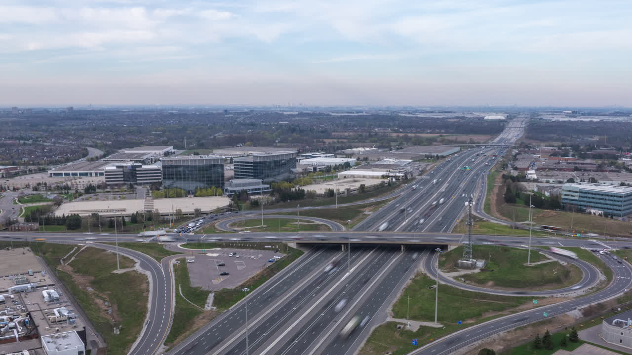 The highway 401 in mississauga, canada, showing fast-moving traffic in a hyperlapse style, aerial view