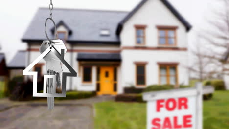 Animation-of-silver-house-key-fob-and-key,-hanging-in-front-of-blurred-house-with-for-sale-sign