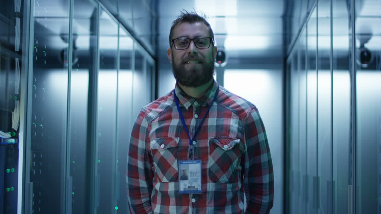Smiling IT Professional in a Data Center