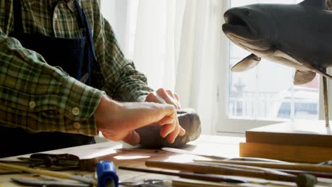 craftsman working on clay sculpture 4k