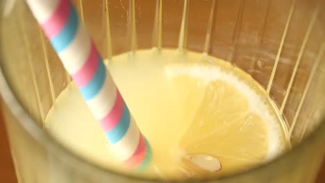 refreshing lemonade in a glass with a straw