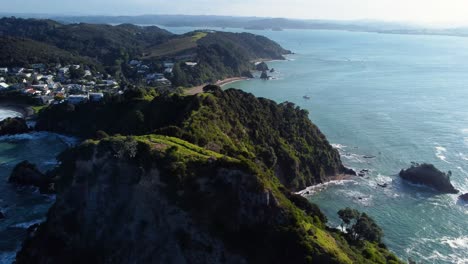 AERIAL Orbiting Shot of a Rocky Cape in Bay of Islands, New Zealand