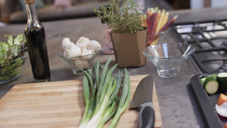 close up of vegetables on worktop in kitchen, slow motion