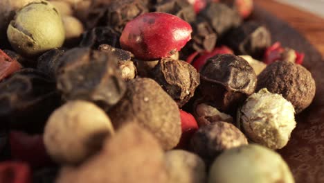 macro close-up mixed peppercorns. dry mix peppercorns close up