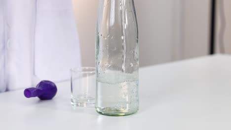 science experiment with a water bottle and balloon
