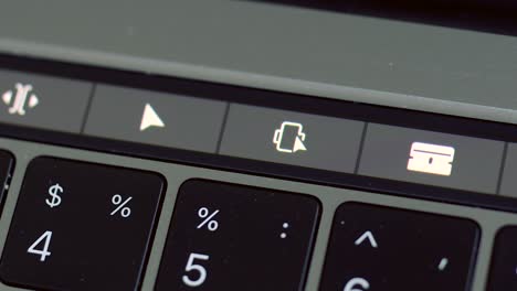 macbook touch bar with video editing controls