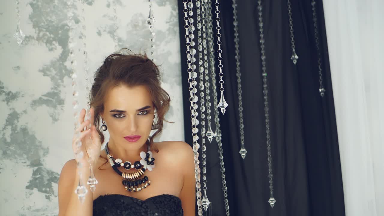 Brunette woman in luxury home interior. Beauty young brunette woman in luxury home interior