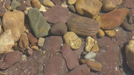 slow motion footage of a shallow rockpool on an australian beach