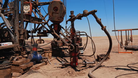 diversity of drilling equipment in the hot deserted field. oil or gas extraction industrial site.