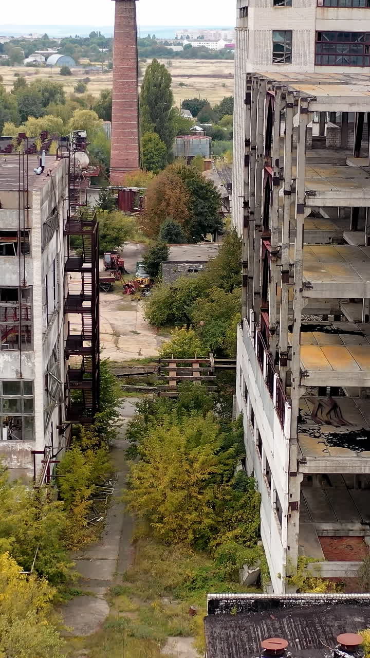 Old destroyed industrial building. Ruined broken city construction industry. Vertical video