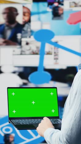 vertical video social media manager uses pc with isolated display for online presence