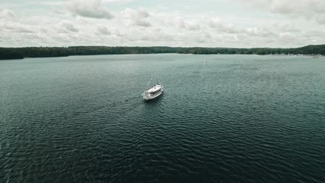 aerial, drone, old and decorated steamboat on a lake, finland, paijänne