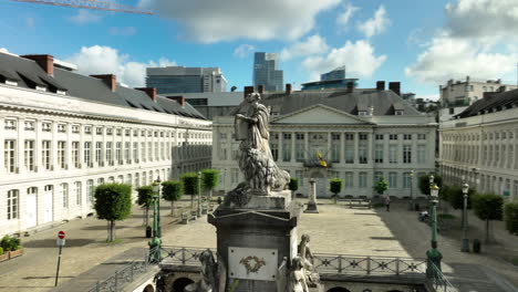 Aerial circling Pro Patria Monument on Place des Martyrs on sunny day, Brussels