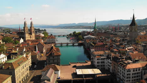 drone dollyshot over the river limmat in zurich, switzerland on a peaceful, warm and sunny summer evening