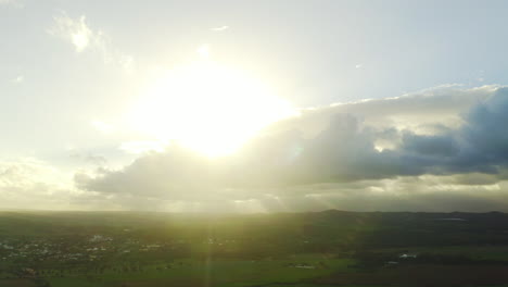 aerial view of a sunny valley with clouds