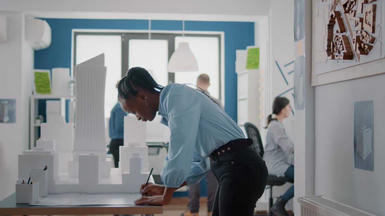 Architects working on a building model in the office