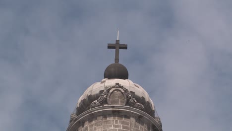 top of tower with cross at catedral metropolitana da la ciudad de mexico