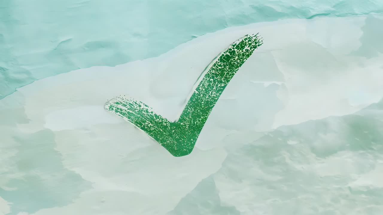 Receding torn paper revealing green glitter check on teal fabric backdrop, signaling confirmation