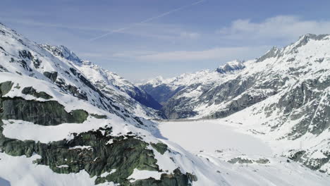 Aerial-of-a-dam-in-winter