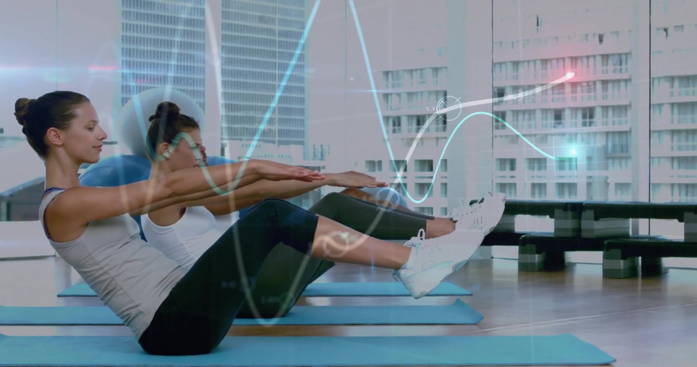 Grupo de personas realizando ejercicios de core en un moderno estudio de fitness