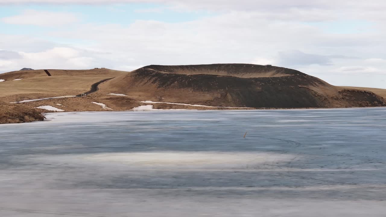 frozen lake view of volcanic pseudocrater at Mývatn near Skútustaðir village in Reykjahlíð area
