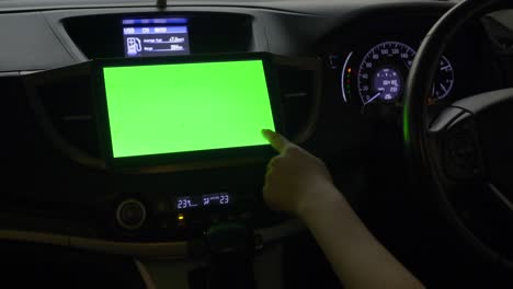 Driver use a multimedia center with green screen