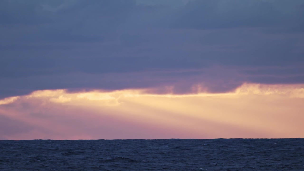 Dramatic Sunset Clouds and Ocean Horizon, Open Ocean Sea View from Boat or Ship Sailing with Dramatic Stormy Sky in Storm, Vast Endless Sea Background with Copy Space on Moving Cruise Ship