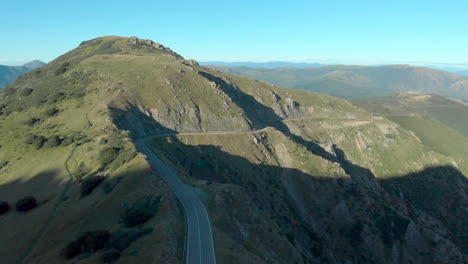 aerial view of ligurian mountains, shadowed section, blue sky