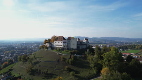 Majestic Lenzburg Castle sits atop a hill, overlooking the town of Lenzburg and surrounding countryside