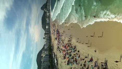 crowds of tourists on copacabana beach in summer in rio de janeiro, brazil