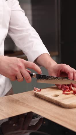 chef slicing prosciutto