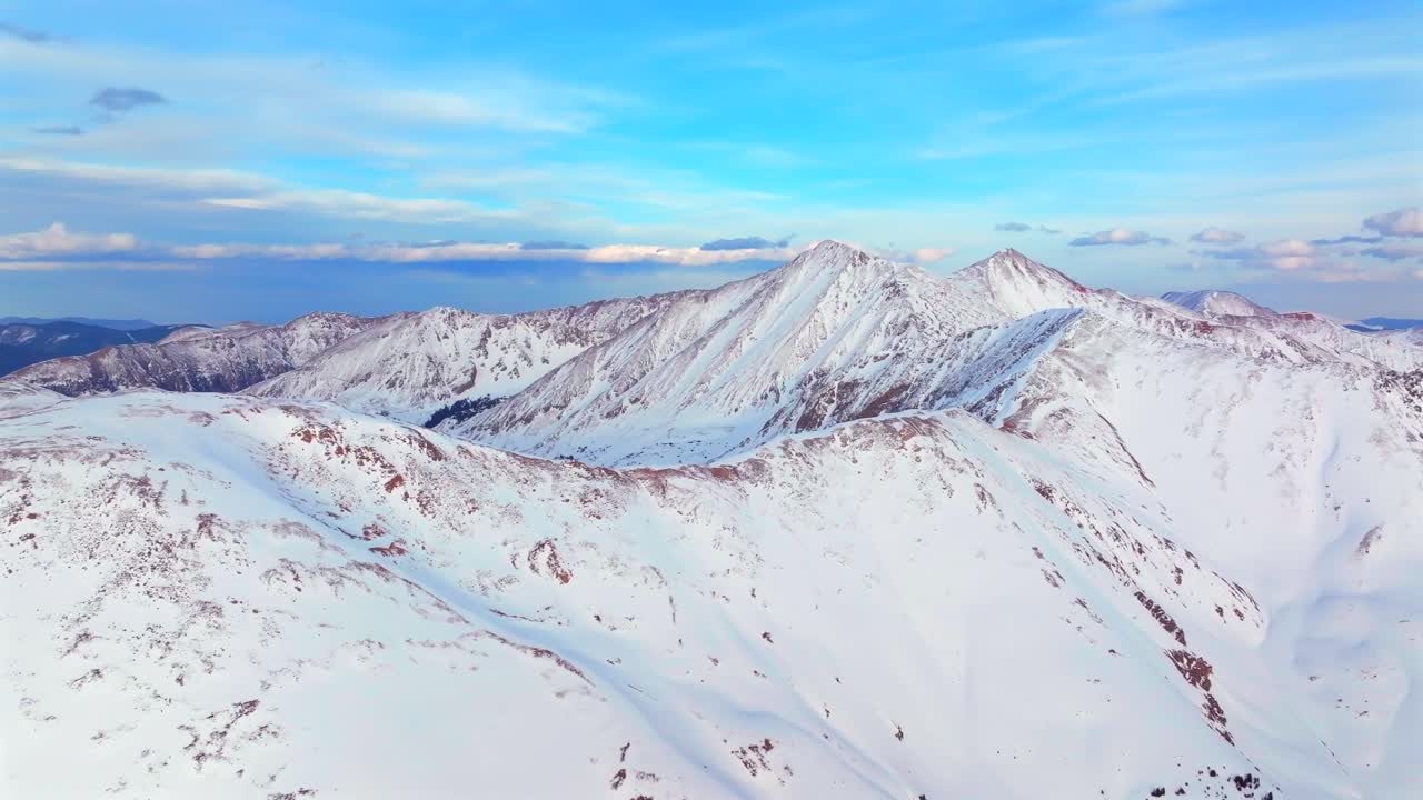 Dead Dog couloir Grays and Torreys 14er Peak Loveland Pass winter spring golden hour sunset Colorado aerial drone forward motion panorama landscape high clouds backcountry snow Rocky Mountains