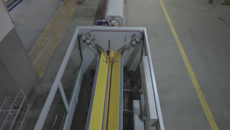 aerial view capturing an automated machine used at manufacturing of pvc pipes at karachi, pakistan.